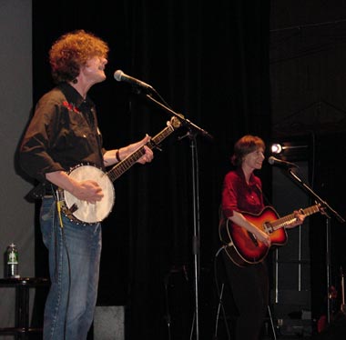 Dave Carter and Tracy Grammer performing on stage.